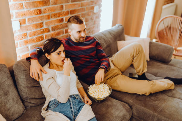 istock Young couple chill on the couch 1384319117