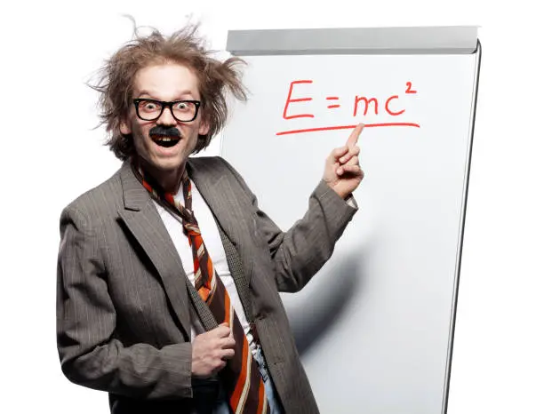 Crazy professor / scientist / lecturer with mad hairstyle wearing horn rimmed glasses and fake mustache standing in front of a whiteboard and pointing at formula E=mc with happy goofy face
