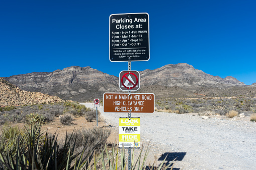 Las Vegas, NV, USA – February 16, 2022: Posted signs on a dirt road in the Red Rock Canyon Area in Southern Nevada.