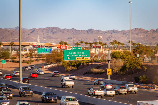 Las Vegas, NV, USA – February 17, 2022: Freeway exit sign for Sunset Road and McCarron Airport on Interstate 215 in Las Vegas, Nevada.