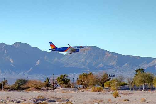 Las Vegas, NV, USA – February 17, 2022: Airliner Allegiant Air coming in for a landing at McCarran Airport in LAs Vegas, Nevada.
