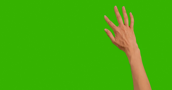 Gestures Chroma Key pack. Gestures at Green Screen Background. Female hand Close Up Showing Multitouch Gestures for Touch Screen: Click, Zoom, Vertical, Horizontal slide, Scrolling. Full green screen.