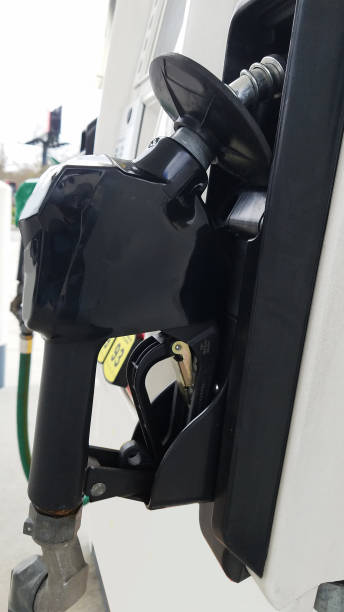 istock Filling up with gas at the pump. 1384325704