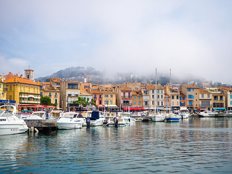 On 29 May 2021, Cassis harbor was under the fog in the morning before the sun arrived, South of France.