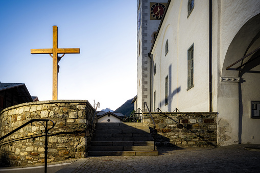 Cruceiro, ancient stone cross backlit, seen along camino de Santiago, near Santiago de Compostela, A Coruña  province, Galicia, Spain.