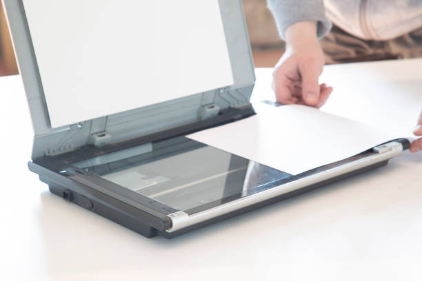 istock A scanner for copying paper files. 1384328333