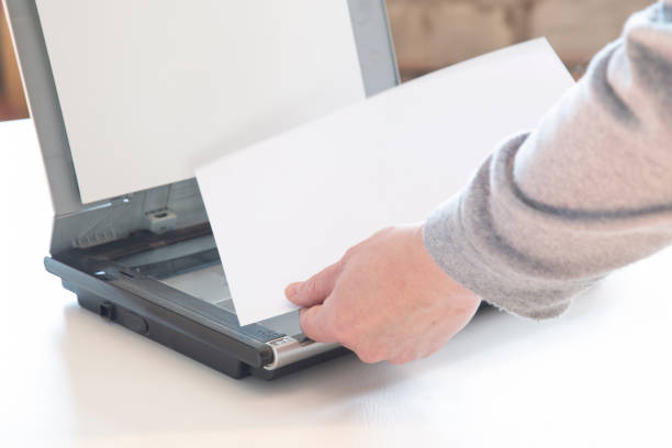istock A scanner for copying paper files. 1384328504