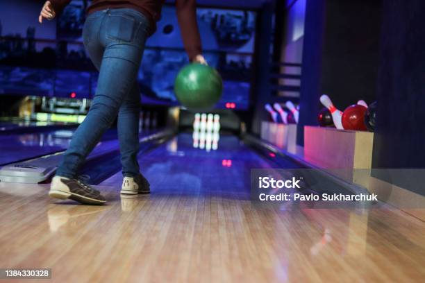 Woman In Club For Bowling Is Throwing Ball Stock Photo - Download Image Now - Lawn Bowling, Bowling Alley, Friendship