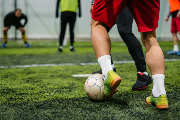 istock Soccer players playing football 1384332129