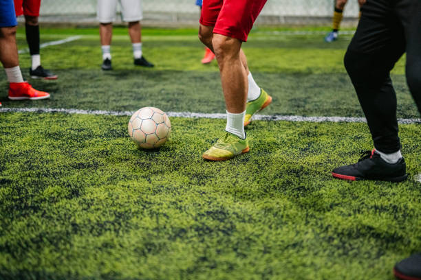 istock Soccer players playing football 1384332669
