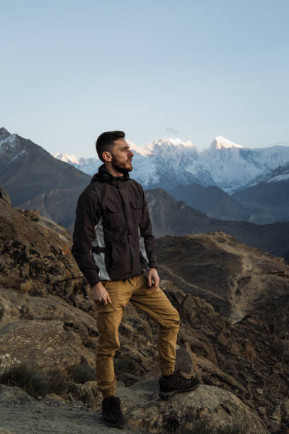 istock A young man enjoy the sunset in Himalayas mountain 1384332856