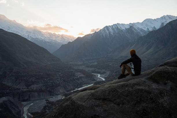 istock A young man enjoy the sunset in Himalayas mountain 1384332916