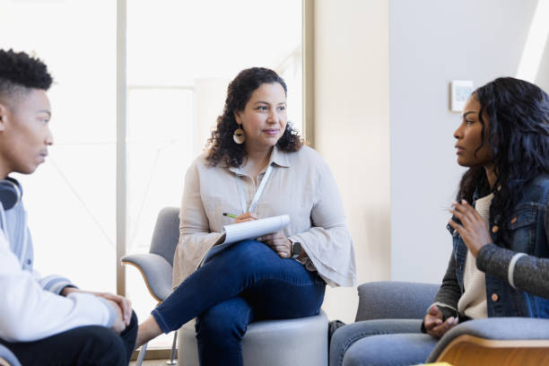 istock Therapist listens to young woman 1384332922