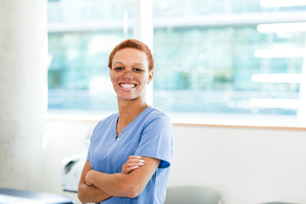 istock Confident, successful female doctor smiles for camera 1384333101