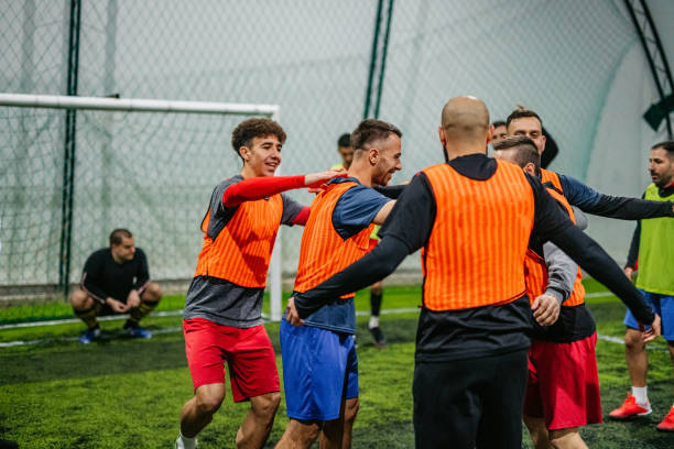 istock Soccer players celebrating victory 1384333175
