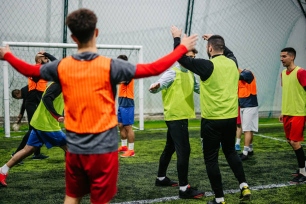 istock Soccer players celebrating victory 1384334051