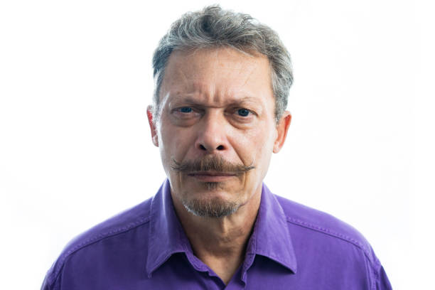 istock Portrait of a senior man, white background 1384336157