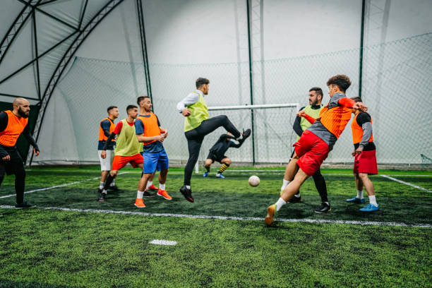 istock Soccer player kicking ball at goal 1384336484