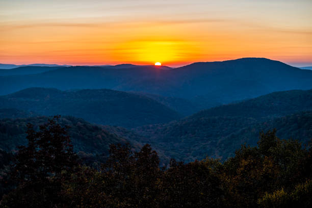 Autumn season foliage with sunrise morning at Highland Scenic highway 150 road in West Virginia Monongahela National Forest Appalachian Mountains stock photo