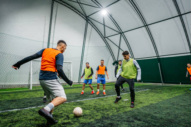 istock Soccer player kicking ball at goal 1384336814
