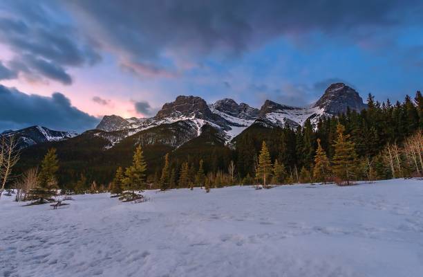 istock Cloudy Sunrise Over A Snowy Mountain Park 1384336849