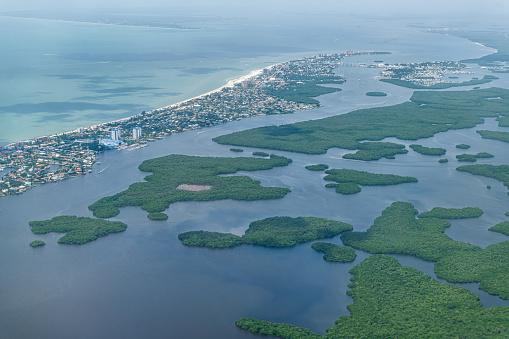 Aerial plane or drone view of Ft Myers beach landscape near Sanibel Island in southwest in Florida Saharan with beautiful green water and Estero Bay Aquatic Preserve
