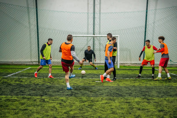 istock Soccer player kicking ball at goal 1384337486