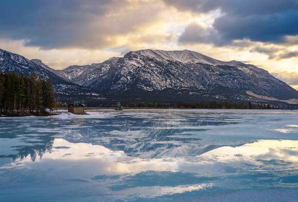istock Sunrise Clouds Reflecting On A Frozen Mountain Lake 1384337692
