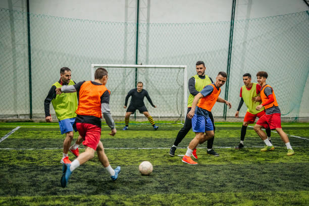 istock Soccer player kicking ball at goal 1384337712