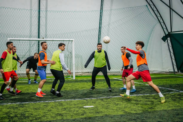 istock Soccer player kicking ball at goal 1384337955