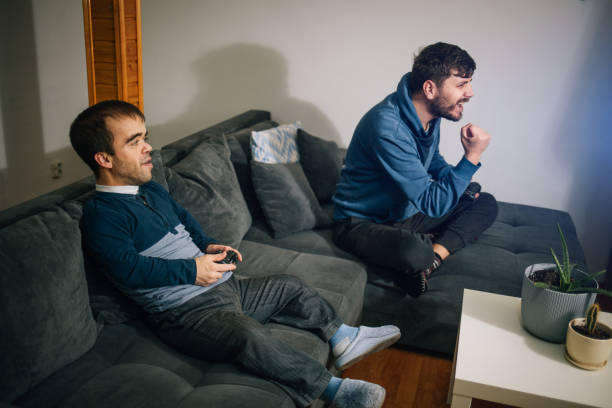 istock Excited friends playing video games 1384338173
