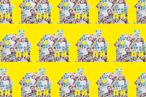 Houses made of Ukrainian hryvnia banknotes. Seamless pattern.