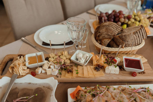 istock Wedding buffet. Slicing different types of cheese. Catering 1384339195
