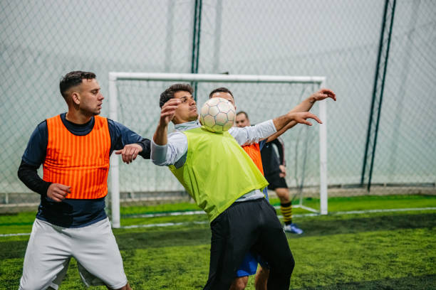 istock Soccer player dribbling ball on field 1384339409
