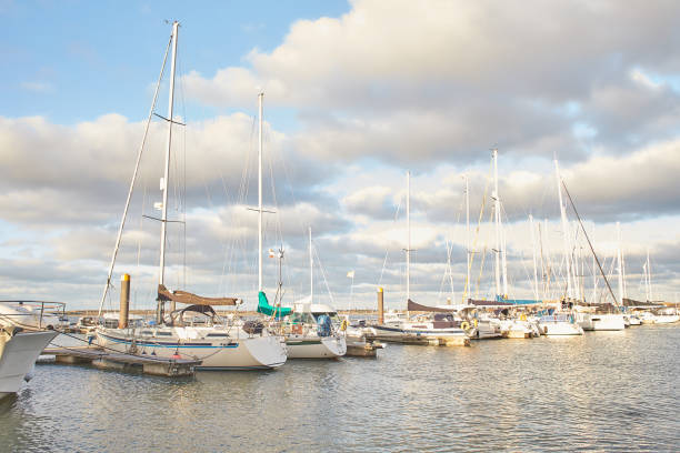 istock Pier with parked boats, yachts in harbor. 1384340635