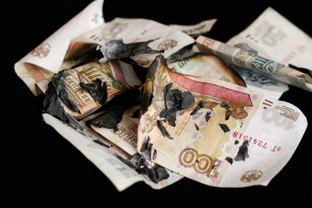 istock Burning money  Russian rubles banknotes 1384341296