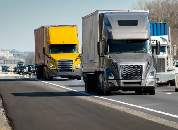 istock Heavy Semi Trucks Convoy On The Interstate 1384341464