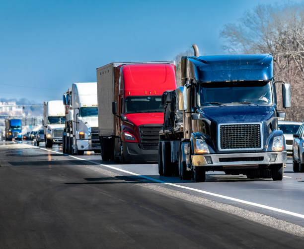 istock Steady Stream of Trucks Rolls Down The Interstate Highway 1384341517