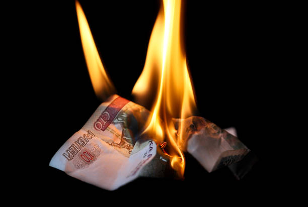 istock Burning money  Russian rubles banknotes 1384343237