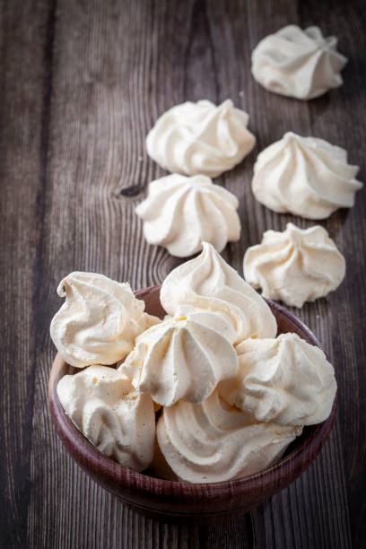 istock Delicious meringue cookies on the table. 1384347125