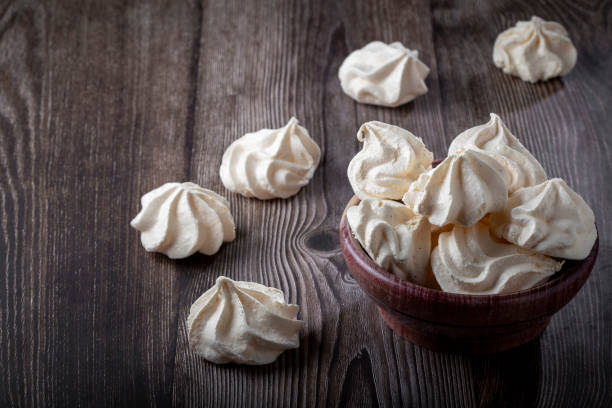 istock Delicious meringue cookies on the table. 1384347136