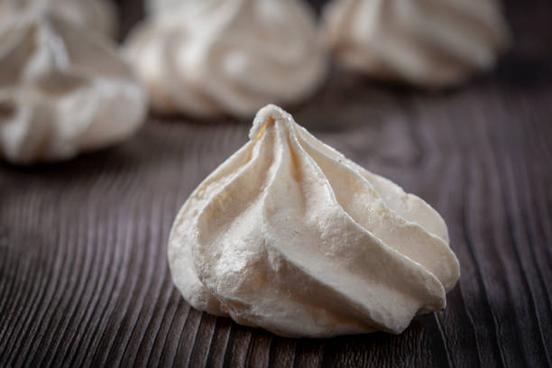 istock Delicious meringue cookies on the table. 1384347201