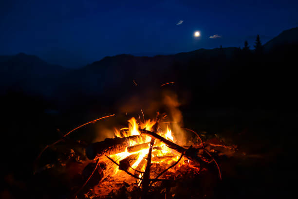 istock Night Moonlight Bonfire Fire in the Mountains 1384347876