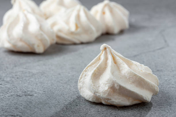 istock Delicious meringue cookies on the table. 1384348945
