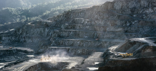 istock Stone drilling and crushing machines working in diabase quarry 1384349473