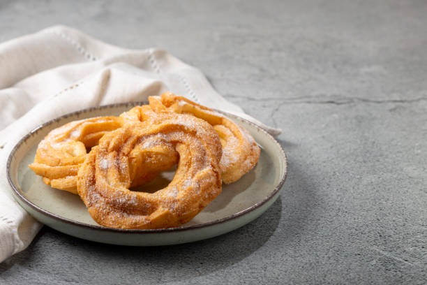 istock Sugared donuts on the table. Brazilian donuts. 1384355905
