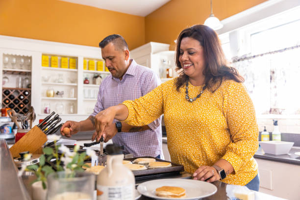 Mexican Family Making Breakfast stock photo