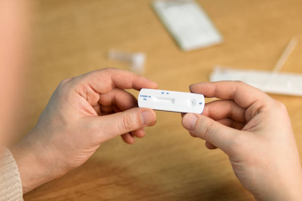 istock Corona virus antigen fast test. Lab card kit test for COVID-19. 1384356052