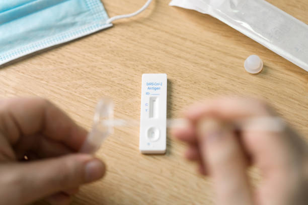 istock Corona virus antigen fast test. Lab card kit test for COVID-19. 1384356735