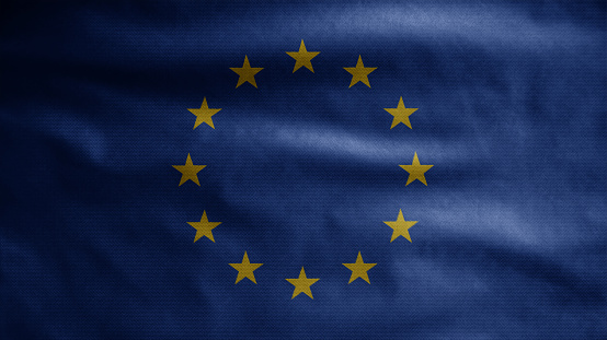 European Union flag waving on wind. Close up of Europe banner blowing soft silk. Cloth fabric texture ensign background. Use it for national day and country occasions concept.